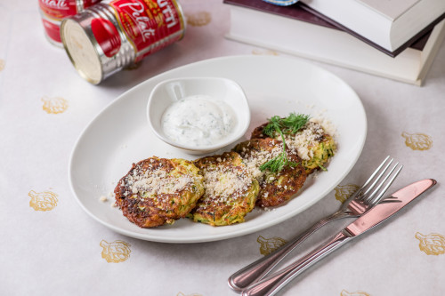 Zucchini pancakes with yoghurt sauce and parmesan