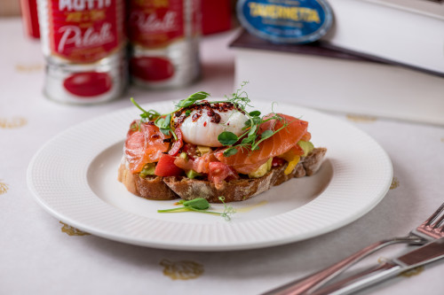 Toast with avocado, lightly salted salmon and poached egg